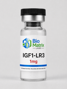 The image shows a vial of IGF1-LR3, a type of growth hormone. The vial is made of clear glass and has a black cap on top. ...